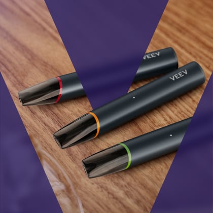 Three VEEV NOW ULTRA devices on the table.